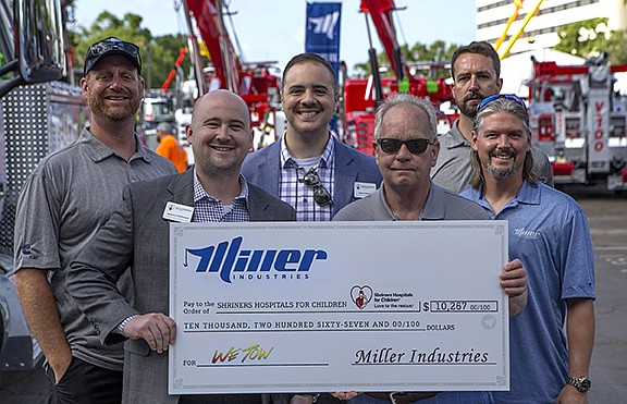 Miller Industries Towing Equipment Inc. donated $10,267 to the Shriners Children's Hospital. The donation was raised through the sale of tow-hook bracelets during the 2017 WeTow campaign hosted by Miller Industries. Shriners Children's Hospitals provide specialized treatment for children with neuromusculoskeletal conditions, burn injuries and other specialized health-care needs. In front, from left, are Jeremy Tomlinson, Shriners Hospitals for Children; Jeff Badgley, Miller Industries; and Joseph Keene, Miller Industries. In back are Kipp Felice, Miller Industries; Drew Deluna, Shriners Hospitals for Children; and Todd Harless, Miller Industries. / Miller Industries Contributed Photo

