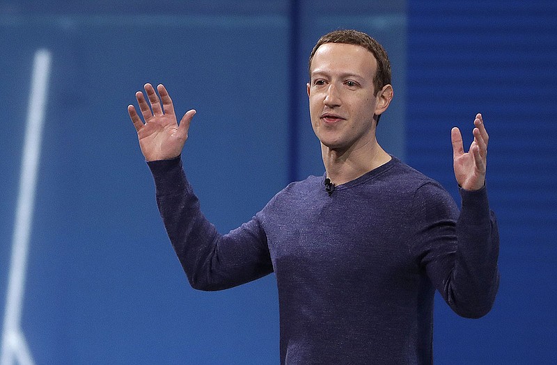 In this May 1, 2018, file photo, Facebook CEO Mark Zuckerberg makes the keynote address at F8, Facebook's developer conference in San Jose, Calif. Remarks from Zuckerberg have sparked criticism from groups such as the Anti-Defamation League. Zuckerberg, who is Jewish, told Recode's Kara Swisher in an interview that although he finds Holocaust denial "deeply offensive," such content should not be banned from Facebook. (AP Photo/Marcio Jose Sanchez, File)