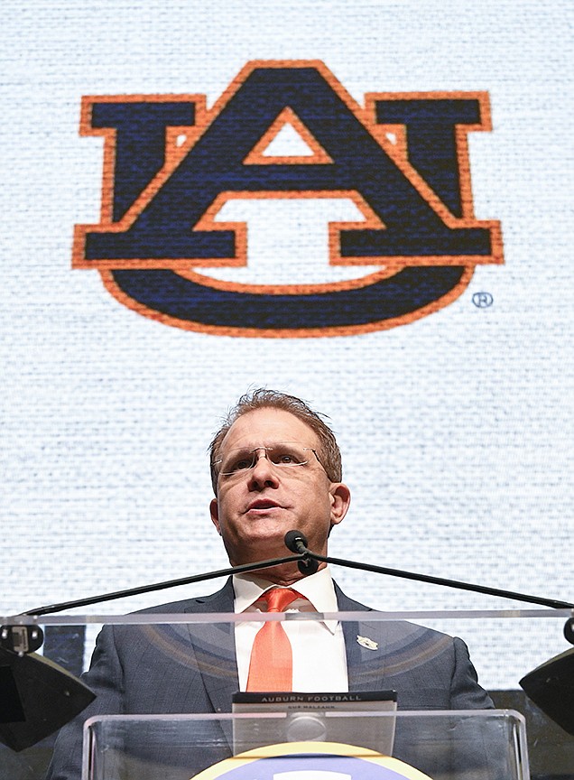NCAA college football head coach Gus Malzahn of Auburn speaks during the Southeastern Conference Media Days at the College Football Hall of Fame in Atlanta, Thursday, July 19, 2018. (AP Photo/John Amis)