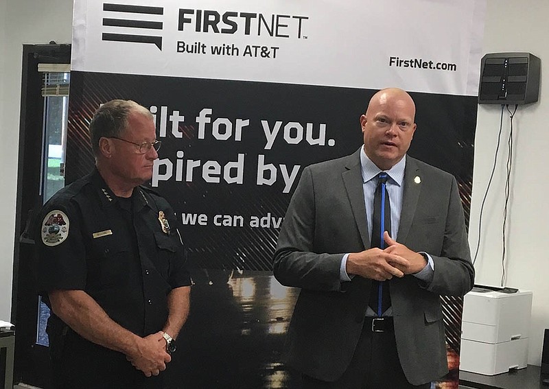Signal Mountain Police Chief Mike Williams, left, listens to Ehrin Ehlert, director of field operations with the First Responder Network Authority.