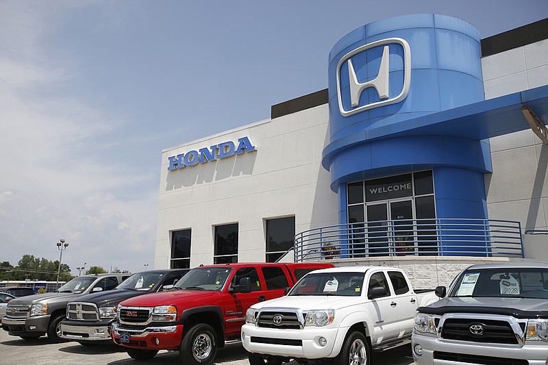 The exterior of Economy Honda is seen Tuesday, Aug. 5, 2014, in Chattanooga, Tenn. The auto dealership sells high numbers of new cars in part thanks to their digital sales and marketing. / Staff photo by Doug Strickland
