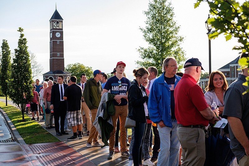 People wait in line to enter a tax policy event hosted by America First policies at Lee University's Pangle Hall on Saturday, July 21, 2018, in Cleveland, Tenn. Vice President Mike Pence will be the keynote speaker at the event, which featured a panel of guests discussing the effects of President Donald Trump's tax bill.