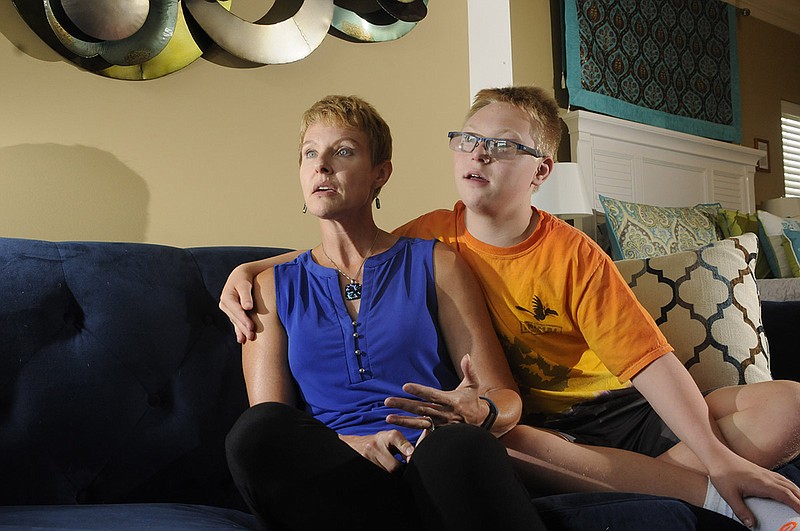 Deborah Rausch talks about special education beside her son, Luka Hyde, at the home in Chattanooga on Friday, July 20, 2018. (Staff photo by Tim Barber)
