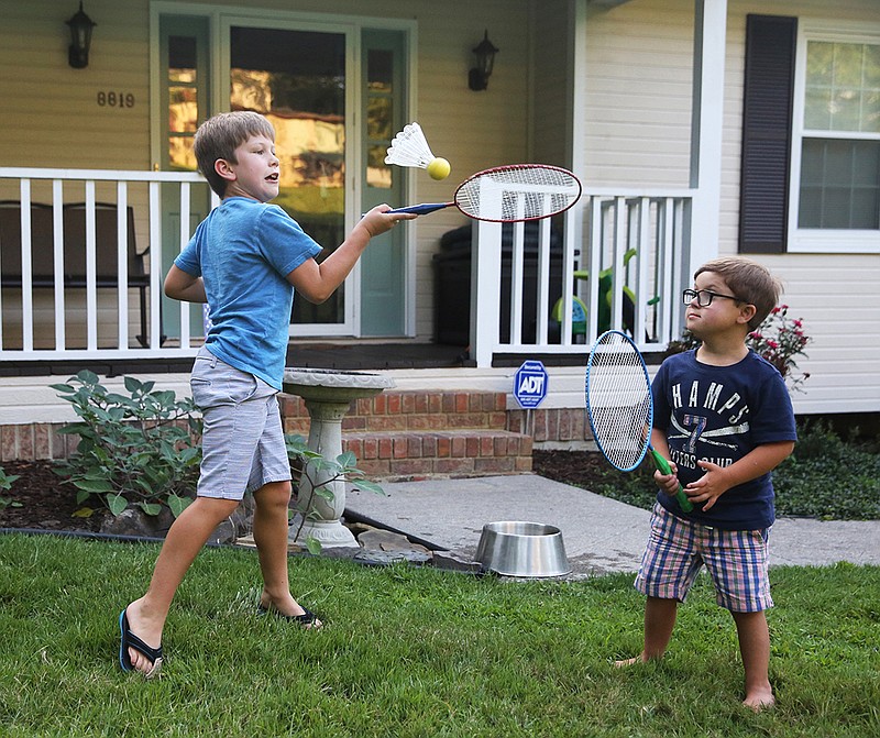 Jackson Penney, 7, plays with his younger brother, Coleson Penney, 6, Friday, July 20, 2018 at their Chattanooga, Tennessee, home. Coleson has Down syndrome, and his family put a lot of research into which school would be best for him. 