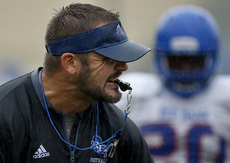 Staff photo by C.B. Schmelter / 
Red Bank coach Chris Brown yells during practice at Red Bank High School on Monday, July 23, 2018 in Chattanooga, Tenn.