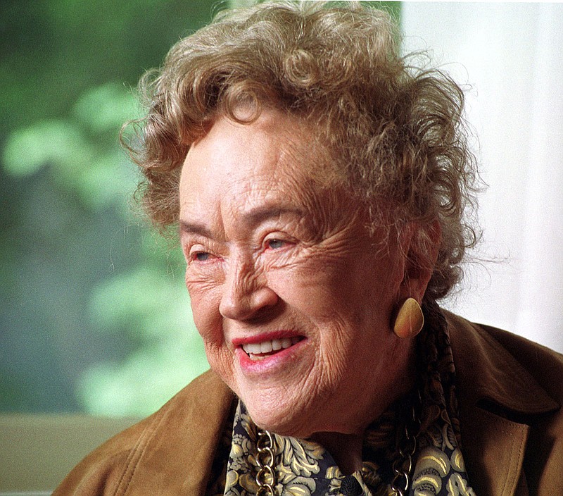 In this Oct. 11, 2001, file photo, famous chef, cookbook author and television show host Julia Child, shares a laugh with students from her alma mater, Smith College in Northampton, Mass. (AP Photo/Nancy Palmieri, File)