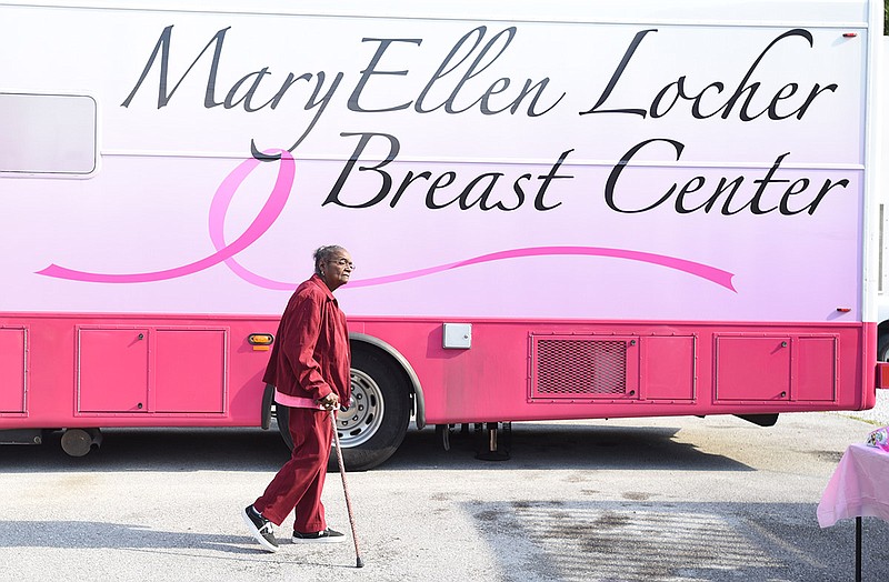 Loretta Morris walks past the mammogram bus on Martin Luther King Boulevard on Oct. 9, 2015.