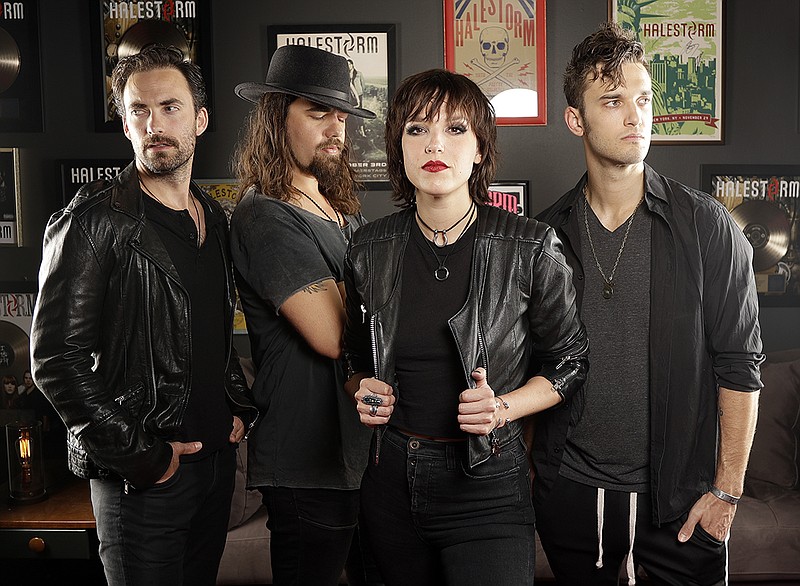 In this July 20, 2018, photo, members of Halestorm, from left, Josh Smith, Joe Hottinger, Lzzy Hale, and Arejay Hale pose in Nashville, Tenn., to promote their new record, "Vicious," out on July 27. (AP Photo/Mark Humphrey)

