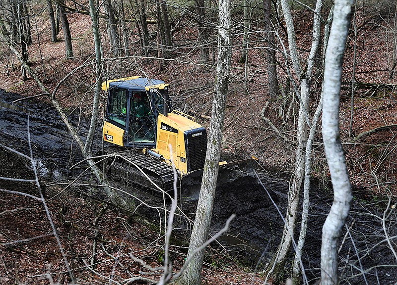 TREED and Associates workers bulldoze areas of along what will be a part of the Mountain Goat Trail Wednesday, March 21, 2018 in Tracy City, Tenn. The multi-use walking and cycling trail will eventually link seven towns in Grundy and Franklin counties.