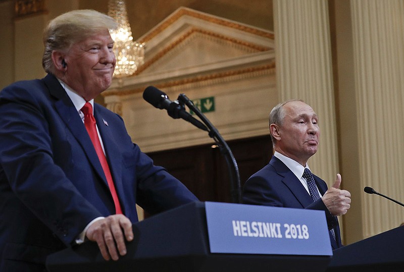 Russian President Vladimir Putin, right, and U.S. President Donald Trump give a joint news conference at the Presidential Palace in Helsinki, Finland, on July 16, 2018. (AP Photo/Pablo Martinez Monsivais)