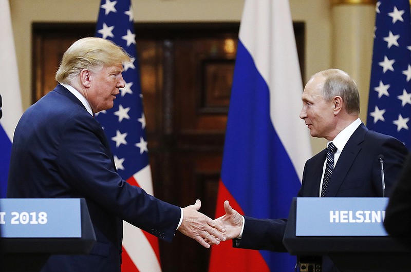 In this file photo taken on Monday, July 16, 2018, U.S. President Donald Trump shakes hand with Russian President Vladimir Putin at the end of the press conference after their meeting at the Presidential Palace in Helsinki, Finland. Pavel Palazhchenko was a constant presence as chief interpreter for Soviet leader Mikhail Gorbachev and Foreign Minister Eduard Shevardnadze, and watched from Moscow to see how the latest chapter in the US-Soviet story would unfold. During an interview Monday July 23, 2018, Palazchenko declined to call the latest Helsinki meeting between US President Trump and Russian President Putin an outright failure, but said there seems a lack of clarity on exactly what the two agreed on. (AP Photo/Alexander Zemlianichenko, File)