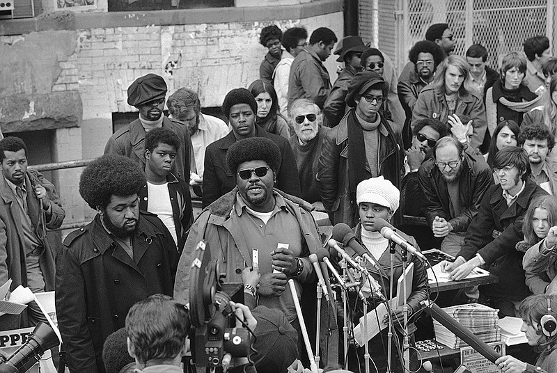 FILE - In this Nov. 27, 1970, file photo, Elbert "Big Man" Howard, deputy Minister of Information for the Black Panther Party, speaks at a sidewalk news conference in Washington. 