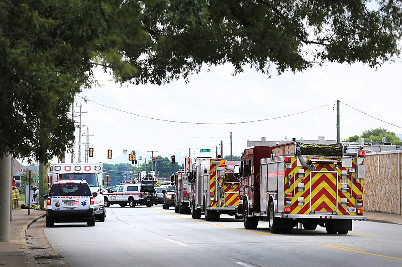 Chattanooga Fire Department trucks line Central Avenue at AABCO Automotive Rebuilders as they work to extinguish a fire Thursday, July 26, 2018, in Chattanooga, Tennessee. Two northbound lanes of Central Avenue were blocked while first responders were on scene.