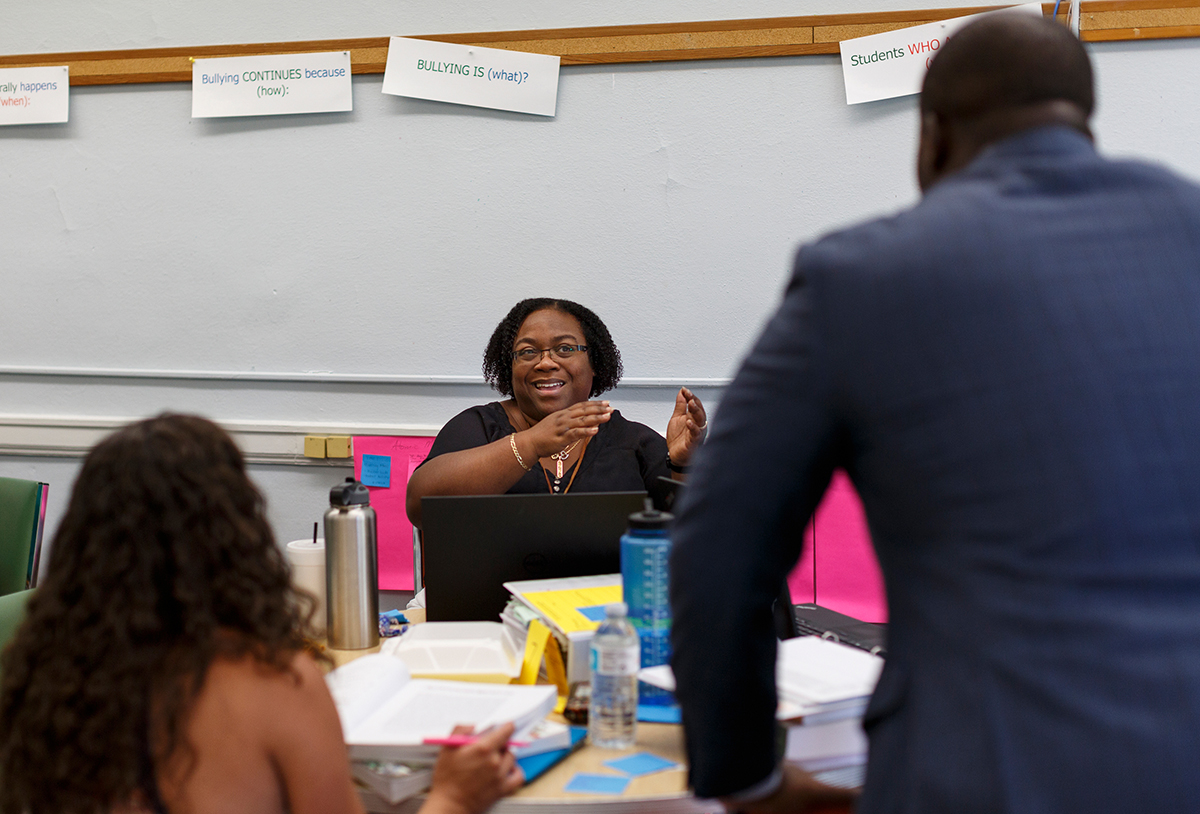 Frenzica Mann tells Hamilton County Schools Superintendent Bryan Johnson about work they are doing in a curriculum mapping workshop on Thursday, July 12, 2018, in Chattanooga, Tenn. Johnson is wrapping up his first year as superintendent.
