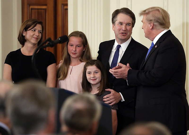 United States Supreme Court nominee Judge Brett Kavanaugh, second from right, and his wife, Ashley, left. (AP Photo/Evan Vucci)