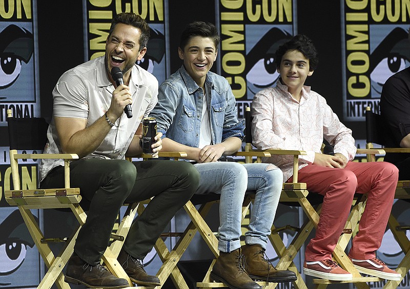 Zachary Levi, Asher Angel and Jack Dylan Grazer, from left, speak at a panel for "Shazam!" at Comic-Con International on Saturday, July 21, 2018, in San Diego. (Photo by Chris Pizzello/Invision/AP)
