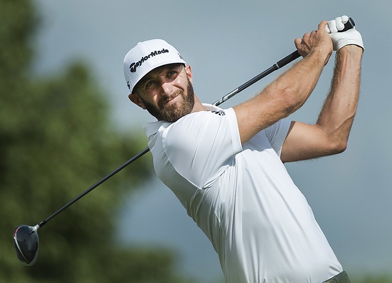 Dustin Johnson tees off on the 17th hole during Saturday's third round of the Canadian Open at Glen Abbey Golf Club in Oakville, Ontario. Johnson shot a 65 and was tied with Byeong Hun An, Whee Kim and Kevin Tway for the lead.