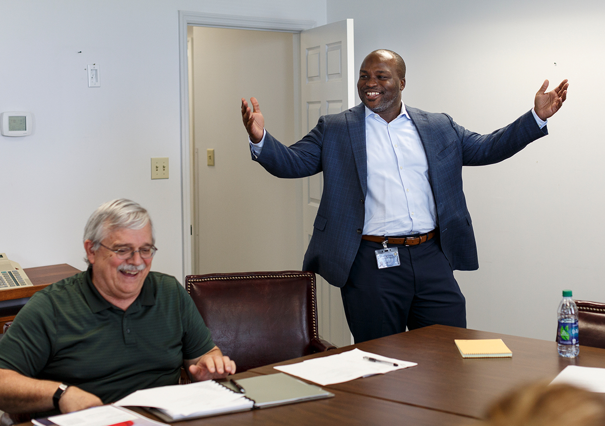 Hamilton County Schools Superintendent Bryan Johnson meets with David McNish, left, and other personnel at the central office building on Thursday, July 12, 2018, in Chattanooga, Tenn. Johnson is wrapping up his first year as superintendent.