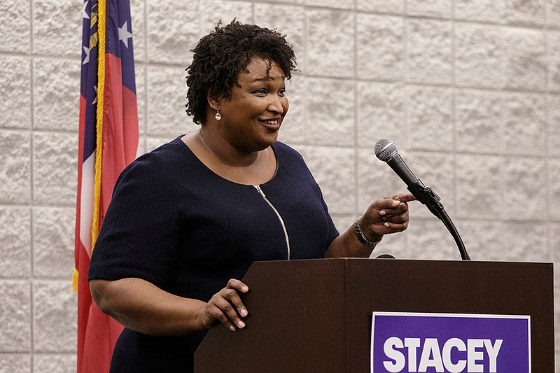 Democratic candidate for governor Stacey Abrams speaks during a town hall forum at the Dalton Convention Center on Wednesday, Aug. 1, 2018, in Dalton, Ga. Abrams is running against Republican candidate Brian Kemp in Georgia's November general election.