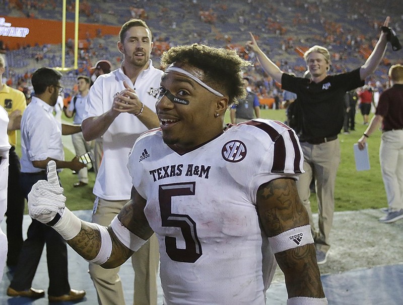 Texas A&M running back Trayveon Williams gives a thumbs-up to fans as he leaves the field after the Aggies won 19-17 at Florida last October. Williams' production dropped last year as a sophomore, but he's optimistic good things are ahead for the Aggies in their first season with Jimbo Fisher as coach.