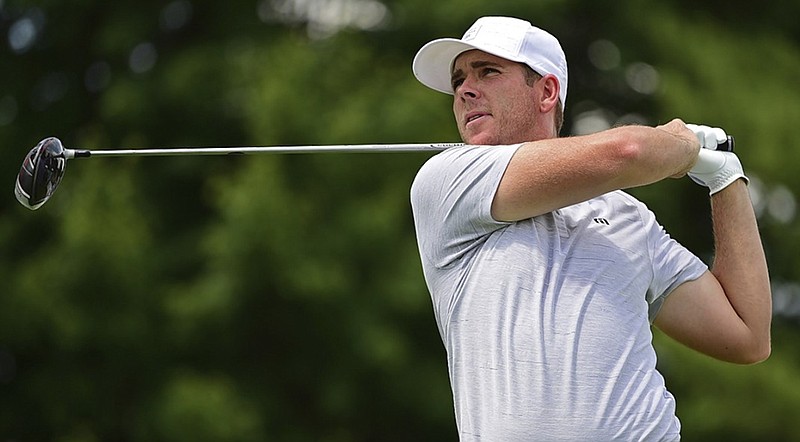 Baylor School graduate Luke List tracks his tee shot on the 17th hole at Firestone Country Club during Thursday's first round of the Bridgestone Invitational in Akron, Ohio. List shot a 65 and was tied for seventh, three shots out of the lead.