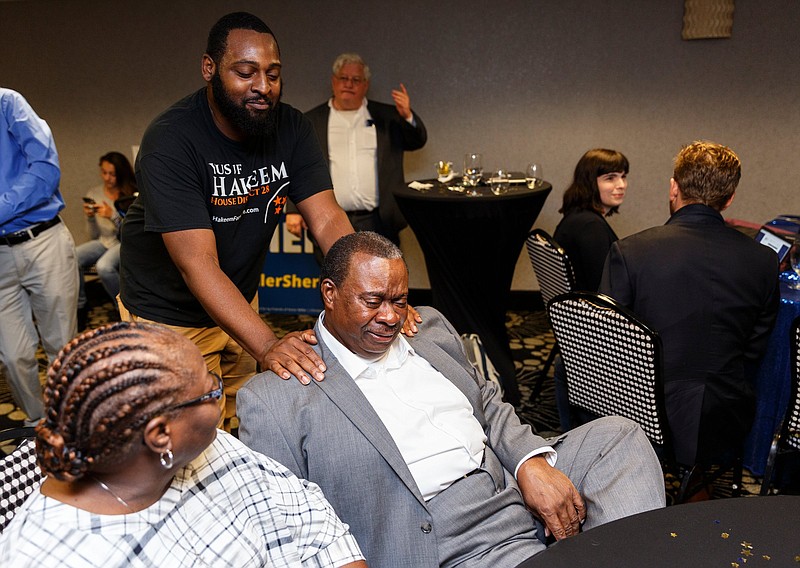 Staff photo by Doug Strickland / 
Democratic candidate for state house district 28 Yusuf Hakeem gets a congratulatory pat on the shoulders from his campaign manager Sean Nix as he becomes emotional while his lead grows during a democratic party election reception at the Doubletree Hotel on Thursday, Aug. 2, 2018, in Chattanooga, Tenn.