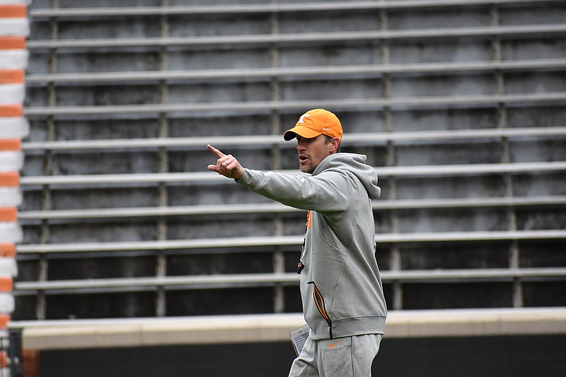 Offensive coordinator Tyson Helton gives commands during drills before Tennessee's scrimmage at Neyland Stadium on April 7, 2018.