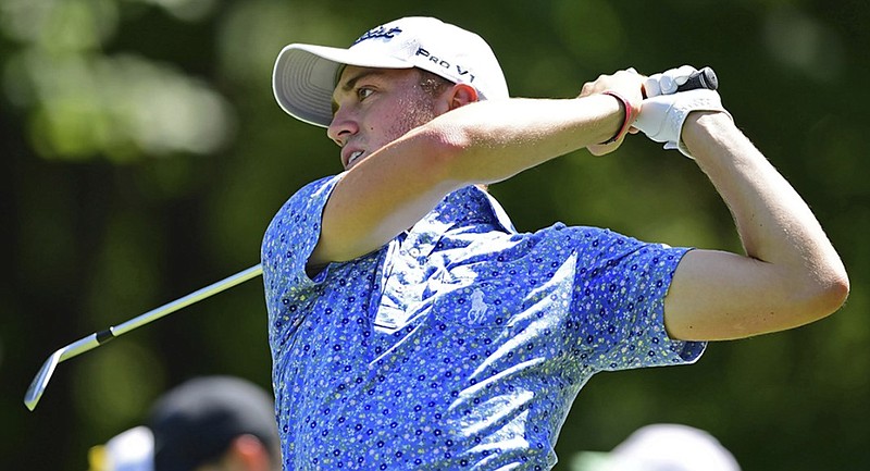 Justin Thomas watches his tee shot on the fifth hole at Firestone Country Club in Akron, Ohio, on Saturday during the third round of the Bridgestone Invitational.