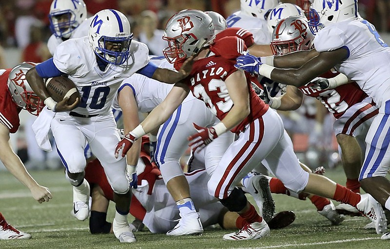 McCallie's Deangelo Hardy (10) tries to get past Baylor's Grayson Panter (33) during the intracity rivals' matchup last October at Baylor's Heywood Stadium.