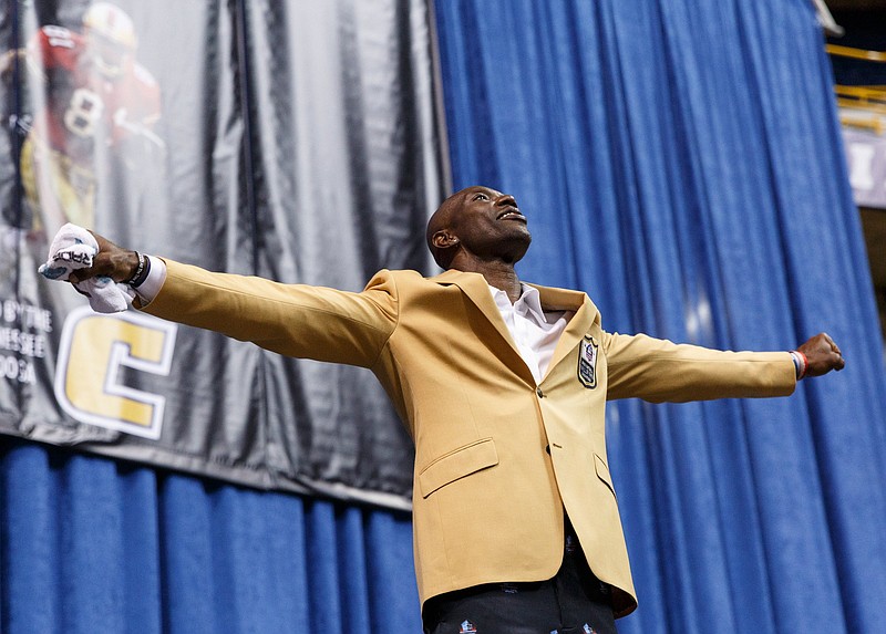 Terrell Owens steps back from the podium after speaking during his Pro Football Hall of Fame induction event Saturday afternoon at UTC's McKenzie Arena. In an unprecedented move, Owens skipped the Hall of Fame ceremony in Canton, Ohio, and held his own at his alma mater.