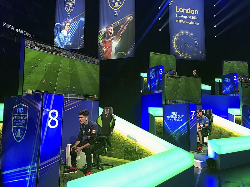 In this photo taken on Thursday, Aug. 2, 2018, competitors take part in the eWorld Cup grand final in London. 