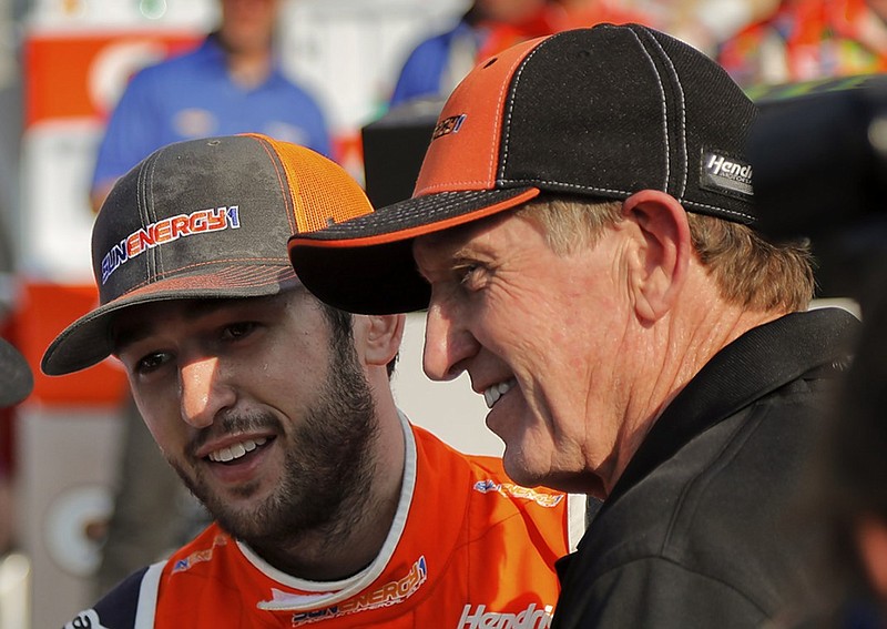 NASCAR driver Chase Elliott, left, and his father, former driver Bill Elliott, answer questions during an interview Sunday at Watkins Glen (N.Y.) International after Chase earned the first Cup Series win of his career.