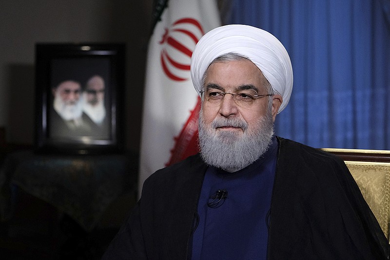 In this photo released by official website of the office of the Iranian Presidency, President Hassan Rouhani addresses the nation in a televised speech in Tehran, Iran, Monday, Aug. 6, 2018. Iranian President Hassan Rouhani struck a hard line Monday as the U.S. restored some sanctions that had been lifted under the 2015 nuclear deal. (Iranian Presidency Office via AP)