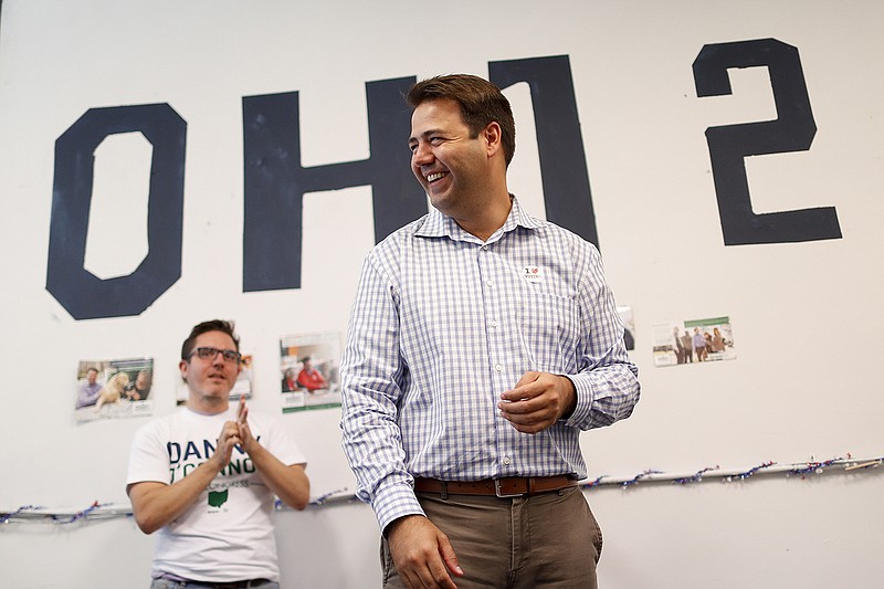Democrat Danny O'Connor, the Franklin County recorder, meets with volunteers at his campaign headquarters, Tuesday, Aug. 7, 2018, in Columbus. The script for Ohio's special election is perhaps familiar: An experienced Trump loyalist, two-term state Sen. Troy Balderson, is fighting off a strong challenge from a fresh-faced Democrat, 31-year-old county official O'Connor, in a congressional district held by the Republican Party for more than three decades. (AP Photo/John Minchillo)