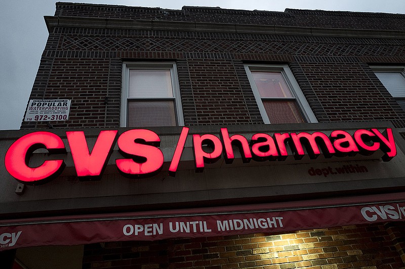 This Dec. 3, 2017, file photo shows a CVS Pharmacy in the Brooklyn borough of New York. CVS Health reports earnings Wednesday, Aug. 8, 2018. (AP Photo/Mark Lennihan, File)