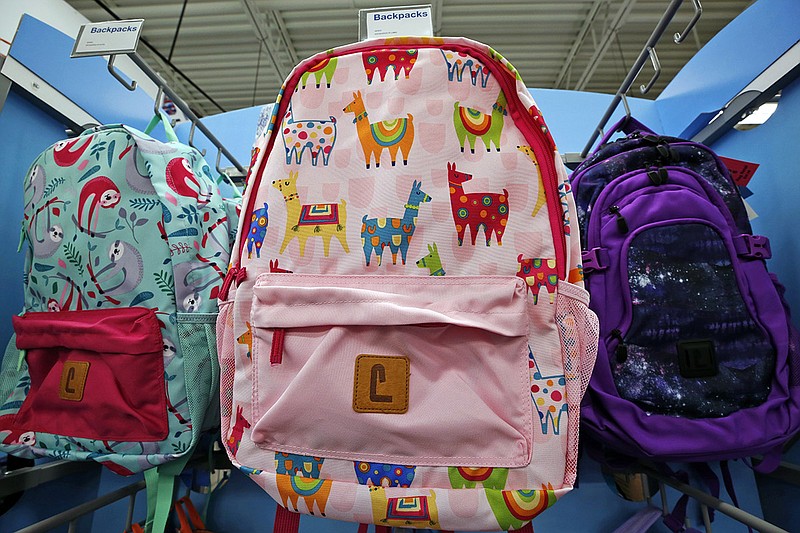 This July 18, 2018, photo shows a display of back to school backpacks in a Staples store in Pittsburgh. Llamas are in demand for decoration on backpacks and other school supplies this year. (AP Photo/Gene J. Puskar)