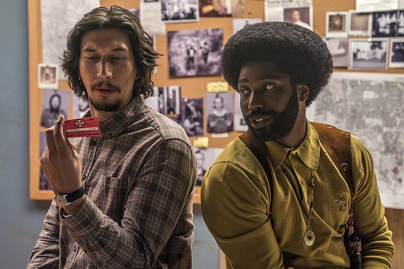 This image released by Focus Features shows Adam Driver, left, and John David Washington in a scene from "BlacKkKlansman." (David Lee/Focus Features via AP)