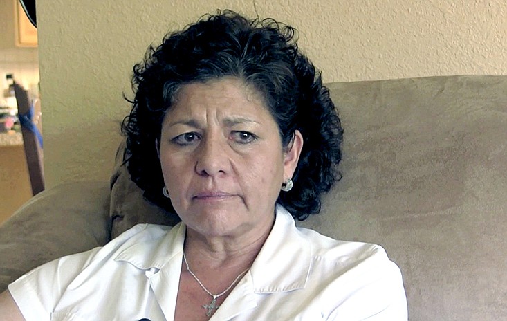 FILE - In this July 14, 2015, file photo from video, Tina Cordova talks of her late father, Anastacio Cordova, in her Albuquerque home. Cordova believes her father, who died in 2013 after suffering from multiple bouts of cancer, was affected by the atomic bomb Trinity Test in New Mexico since he lived in nearby Tularosa, N.M. as a child.