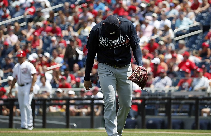Atlanta Braves starting pitcher Anibal Sanchez walks off the field after being hit in the left calf by a ball off the bat of the Washington Nationals' Michael Taylor during the second inning Thursday. He did not return to the game.