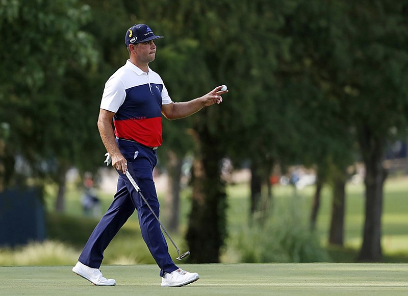 Gary Woodland acknowledges the crowd after making a birdie putt on the 17th hole at Bellerive Country Club in St. Louis during Thursday's opening round of the PGA Championship.