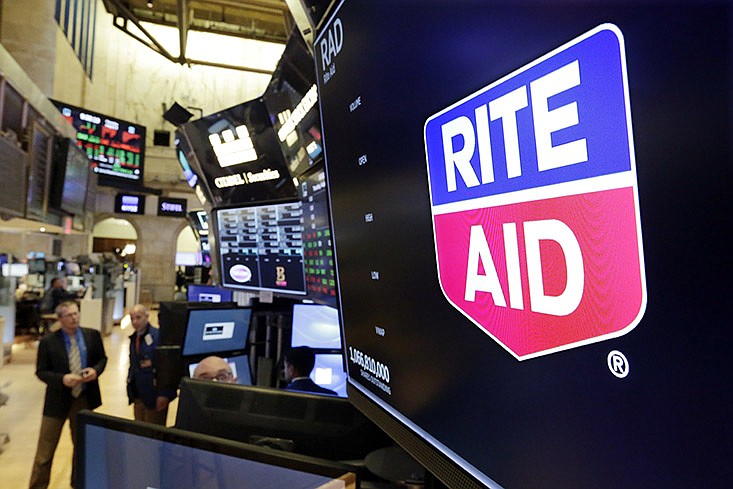 The logo for Rite Aid is displayed above a trading post on the floor of the New York Stock Exchange, Thursday, Aug. 9, 2018. Rite Aid and the grocer Albertsons called off an agreement to become a single company with the deal facing shaky prospects in a shareholder vote.(AP Photo/Richard Drew)