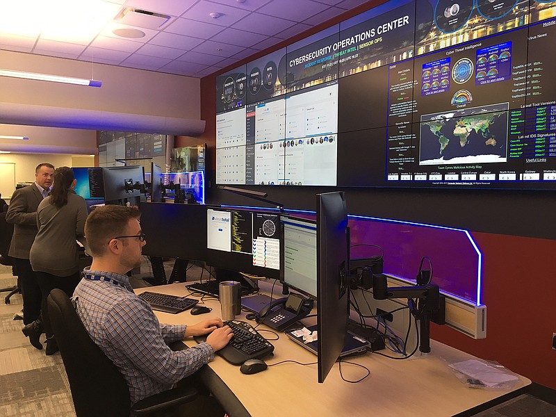 Beneath a giant wall screen displaying areas of potential concern in TVA's 7-state region, cyber security experts monitor a portion of the 2 billion activities across TVA's digital platforms every day at the downtown Chattanooga Office Complex. (Photo contributed by TVA)