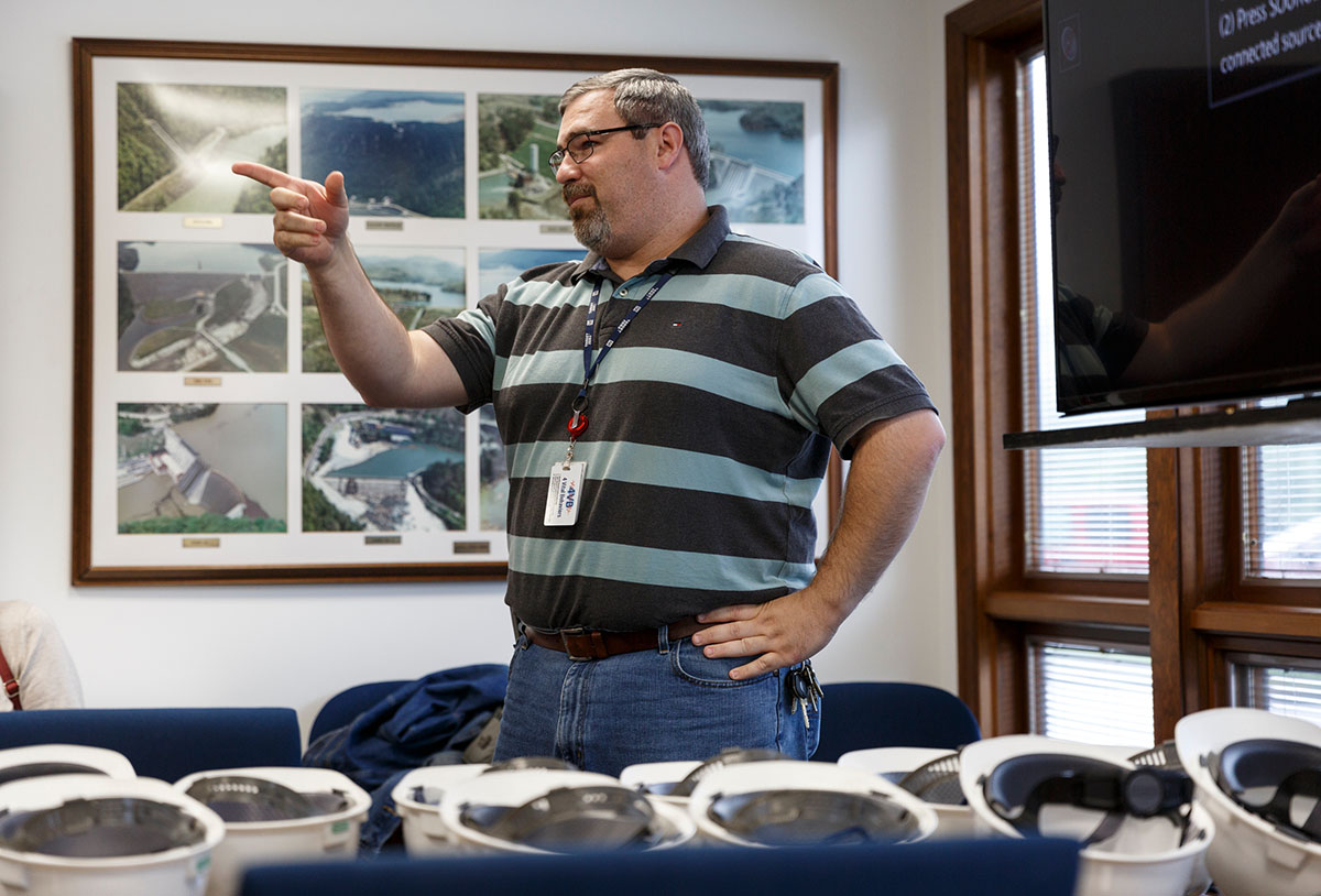 Plant manager Thomas Gamble speaks to a tour group before entering TVA's Raccoon Mountain Pumped-Storage Plant on Friday, Aug. 10, 2018, in Chattanooga, Tenn. The hydroelectric facility halted tours for the public after the September 11 terrorist attacks in 2001, but they began offering tours again this year.