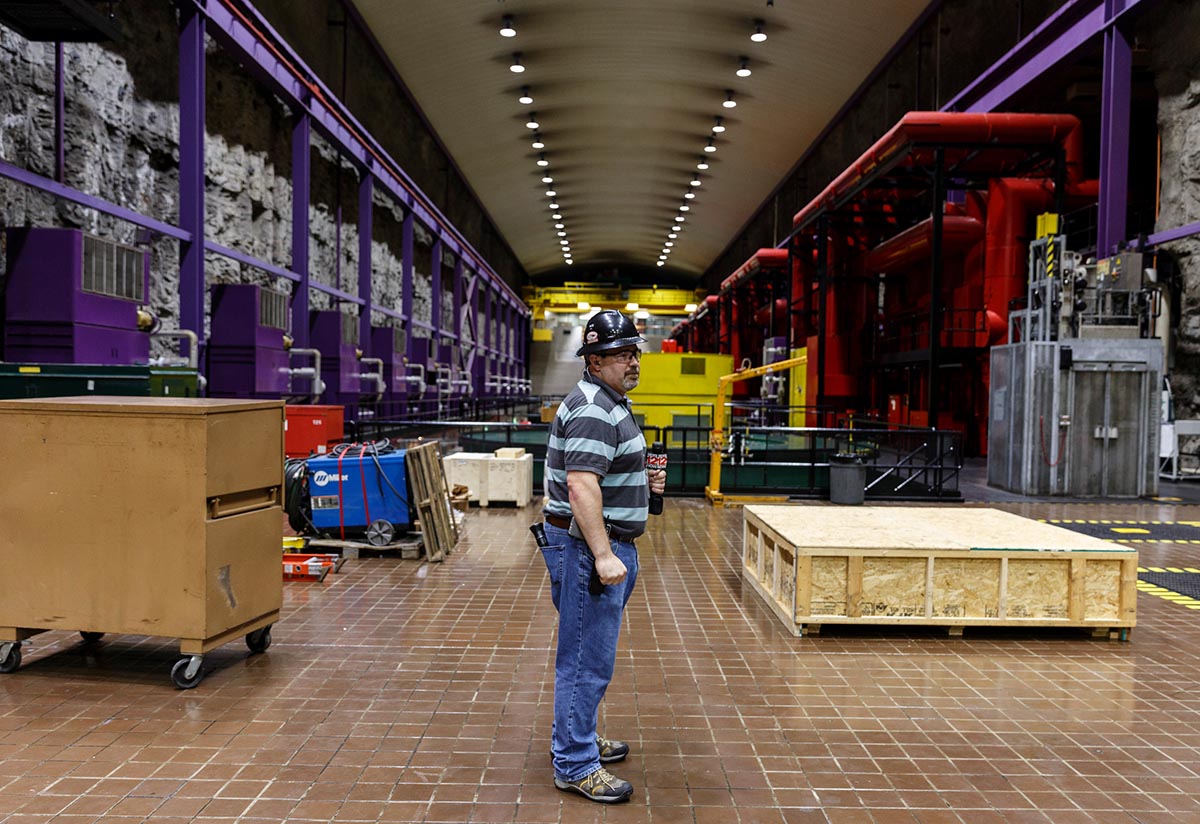 Plant manager Thomas Gamble stands on the powerhouse floor inside TVA's Raccoon Mountain Pumped-Storage Plant on Friday, Aug. 10, 2018, in Chattanooga, Tenn. The hydroelectric facility halted tours for the public after the September 11 terrorist attacks in 2001, but they began offering tours again this year.