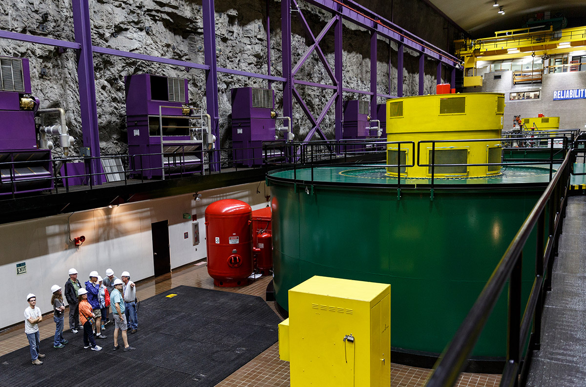 A group is given a tour of the powerhouse floor in TVA's Raccoon Mountain Pumped-Storage Plant on Friday, Aug. 10, 2018, in Chattanooga, Tenn. The hydroelectric facility halted tours for the public after the September 11 terrorist attacks in 2001, but they began offering tours again this year.