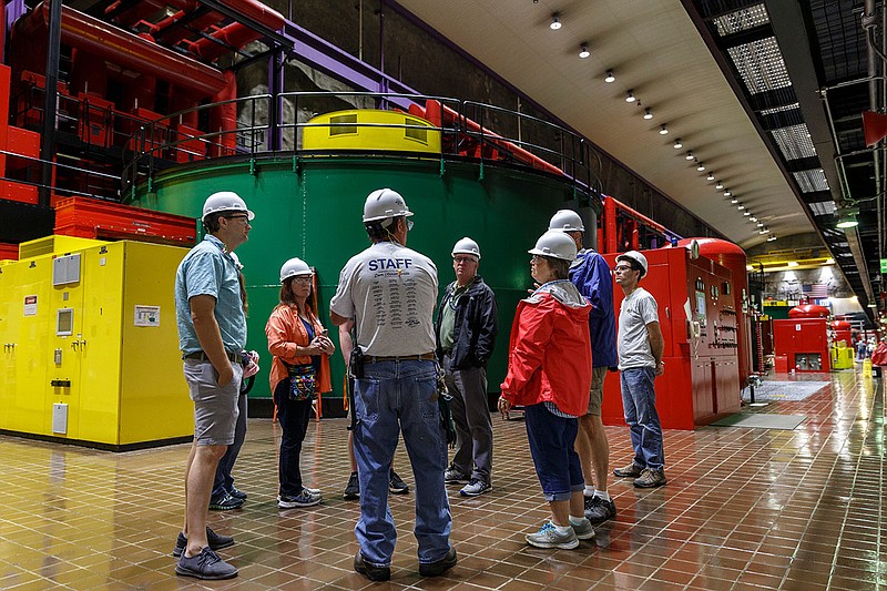A group is given a tour of the powerhouse floor in TVA's Raccoon Mountain Pumped-Storage Plant on Friday, Aug. 10, 2018, in Chattanooga, Tenn. The hydroelectric facility halted tours for the public after the September 11 terrorist attacks in 2001, but they began offering tours again this year.