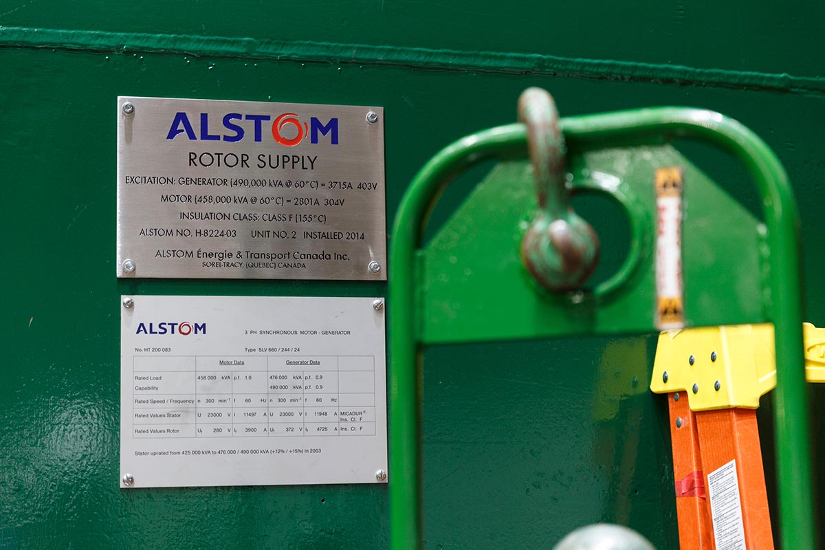 An Alstom sign hangs on the side of a generator inside TVA's Raccoon Mountain Pumped-Storage Plant on Friday, Aug. 10, 2018, in Chattanooga, Tenn. The hydroelectric facility halted tours for the public after the September 11 terrorist attacks in 2001, but they began offering tours again this year.