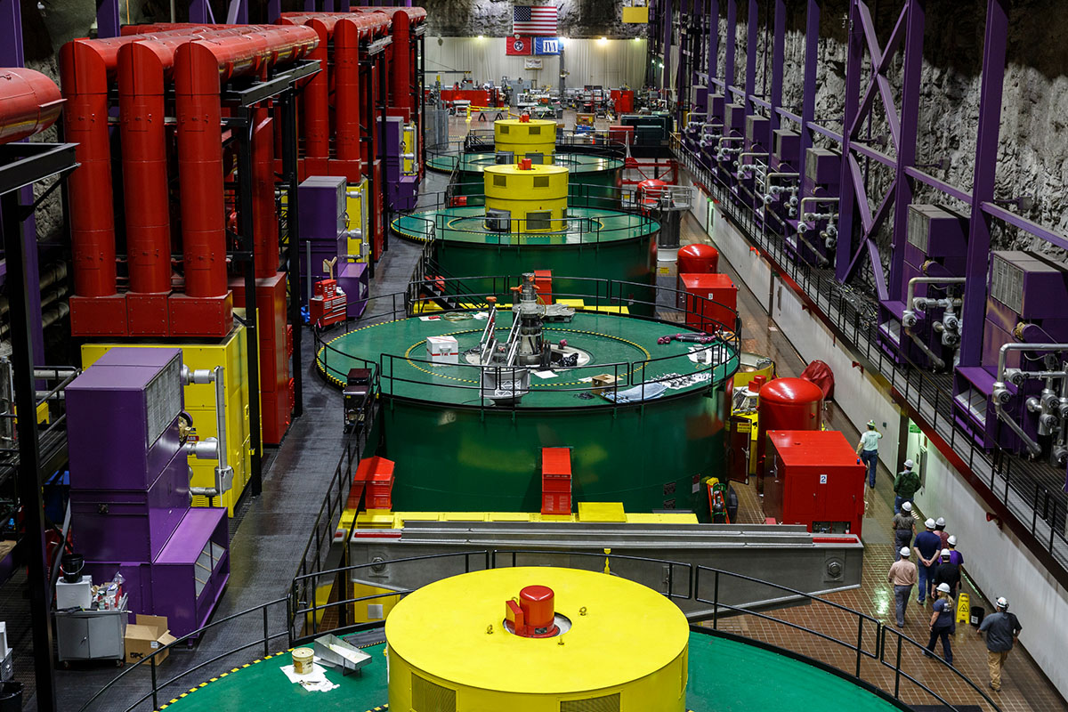 A group stands near a generator during a tour of the powerhouse floor in TVA's Raccoon Mountain Pumped-Storage Plant on Friday, Aug. 10, 2018, in Chattanooga, Tenn. The hydroelectric facility halted tours for the public after the September 11 terrorist attacks in 2001, but they began offering tours again this year.