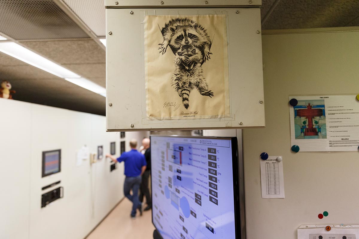 A drawing of raccoons hangs in the control room of TVA's Raccoon Mountain Pumped-Storage Plant on Friday, Aug. 10, 2018, in Chattanooga, Tenn. The hydroelectric facility halted tours for the public after the September 11 terrorist attacks in 2001, but they began offering tours again this year.