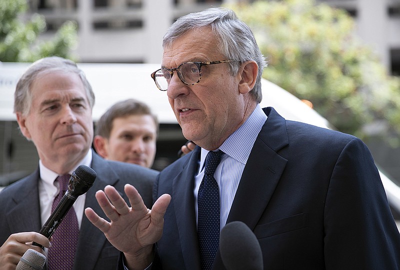 Paul Kamenar, attorney for Andrew Miller, joined by Peter Flaherty, chairman of the National Legal and Policy Center, left, talks to reporters after a federal judge found Miller in contempt for refusing to testify before the grand jury hearing evidence in special counsel Robert Mueller's investigation of Russian interference in the 2016 presidential election, at the District Court in Washington, Friday, Aug. 10, 2018. (AP Photo/J. Scott Applewhite)